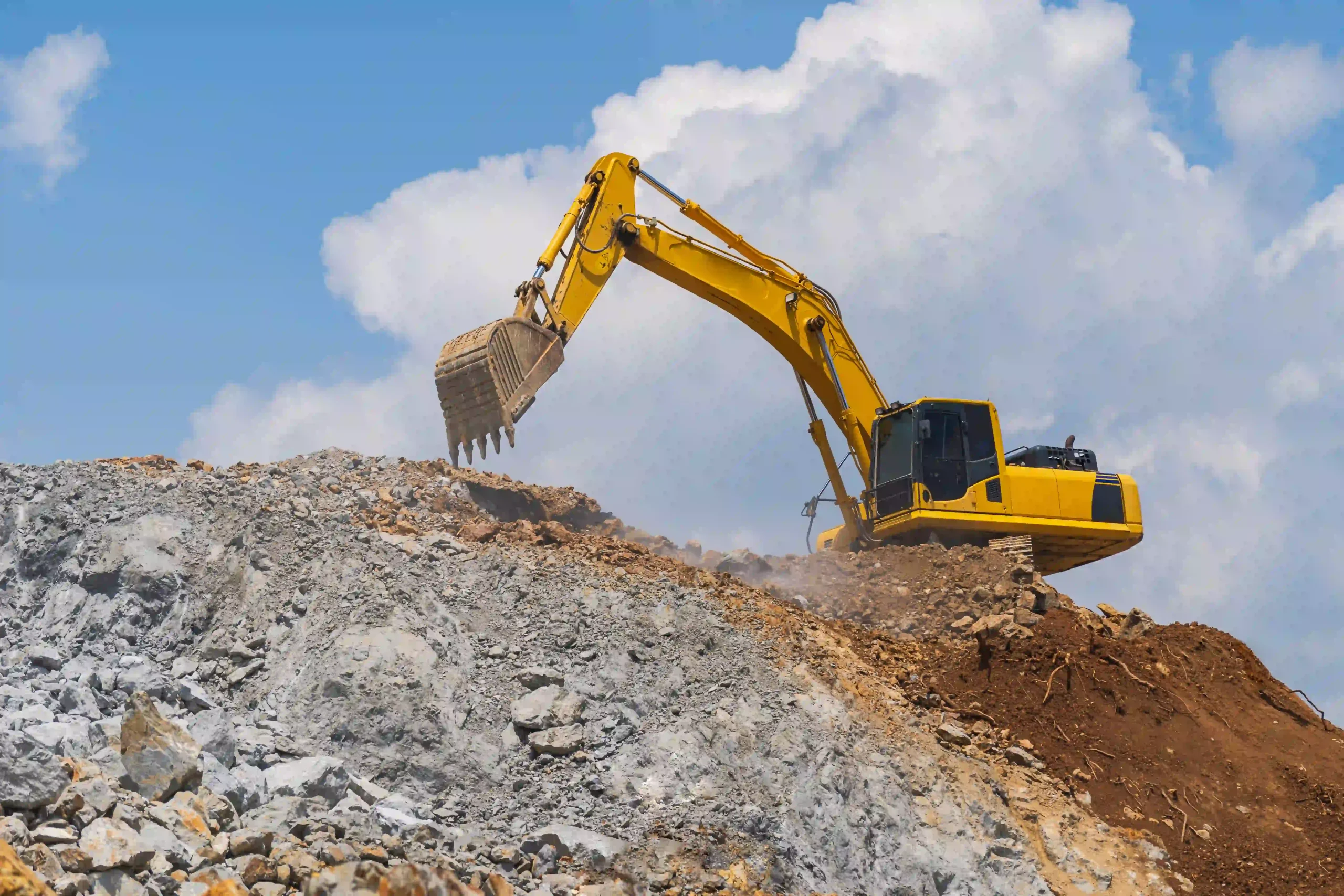 excavator working outdoors under blue sky free photo